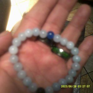 handmade stretchy natural aquamarine bracelet with a sapphire focal point